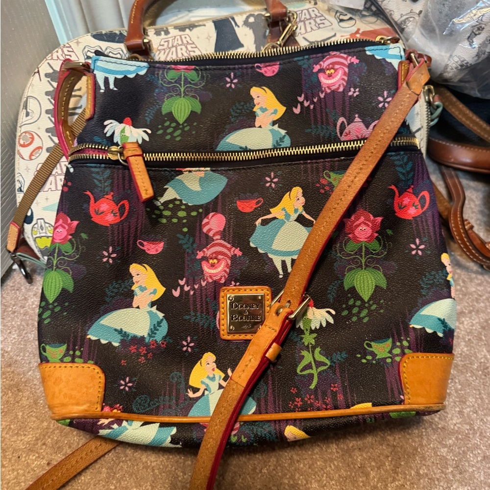 Dooney & Bourke Black Alice Print Crossbody Backpack with Teal & Pink Accents